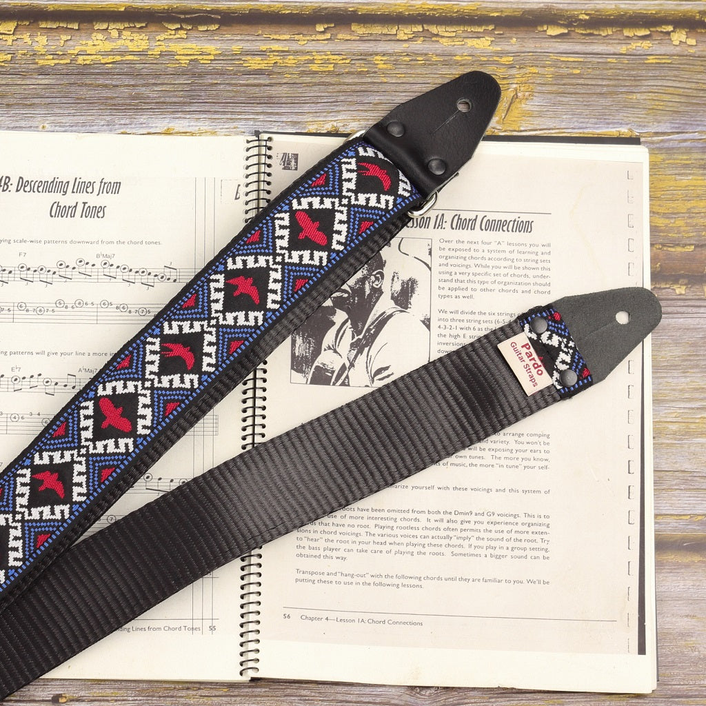 Guitar strap with birds backing seatbelt