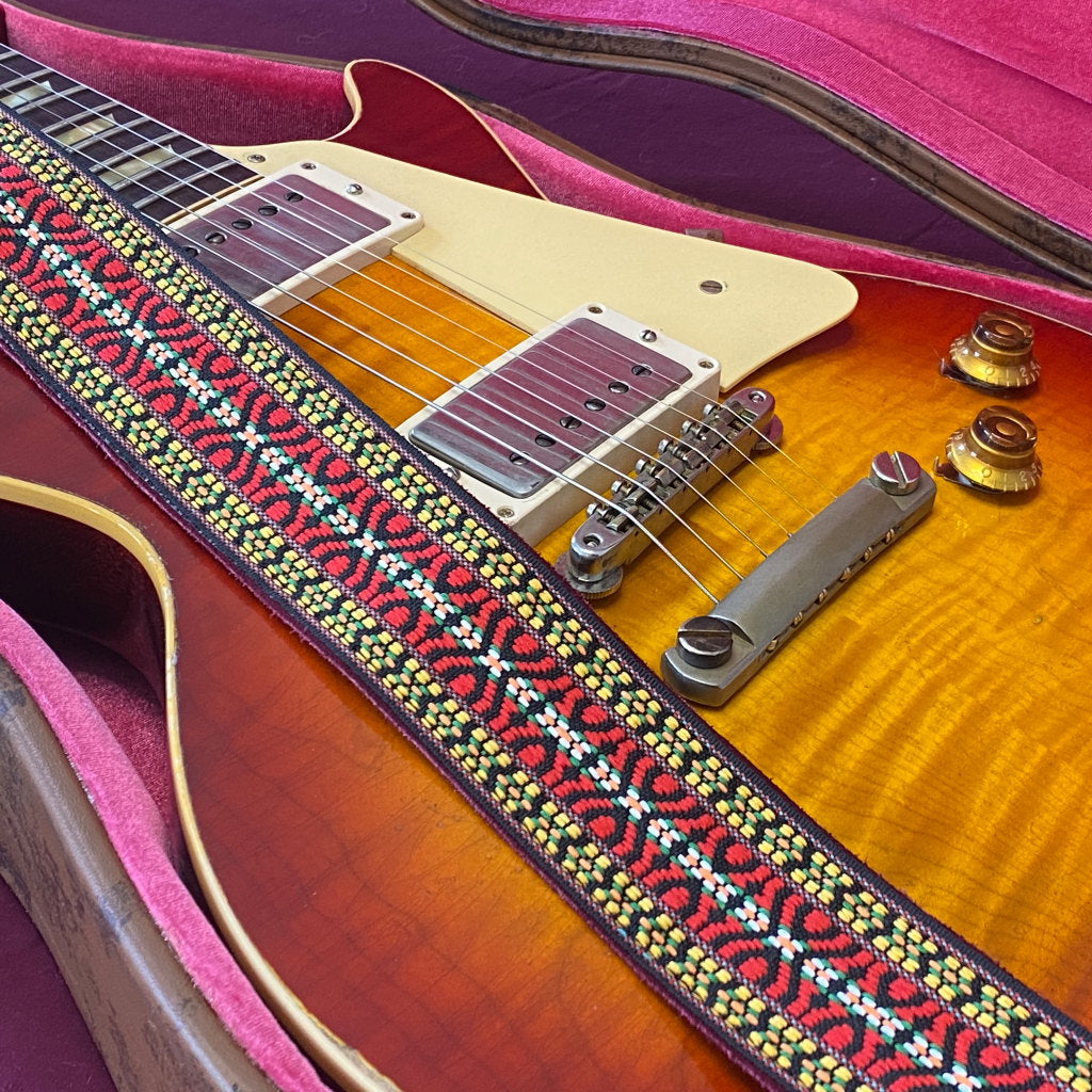 Gibson R9 Murphy Lab paired with a vintage-style strap seen in iconic performances