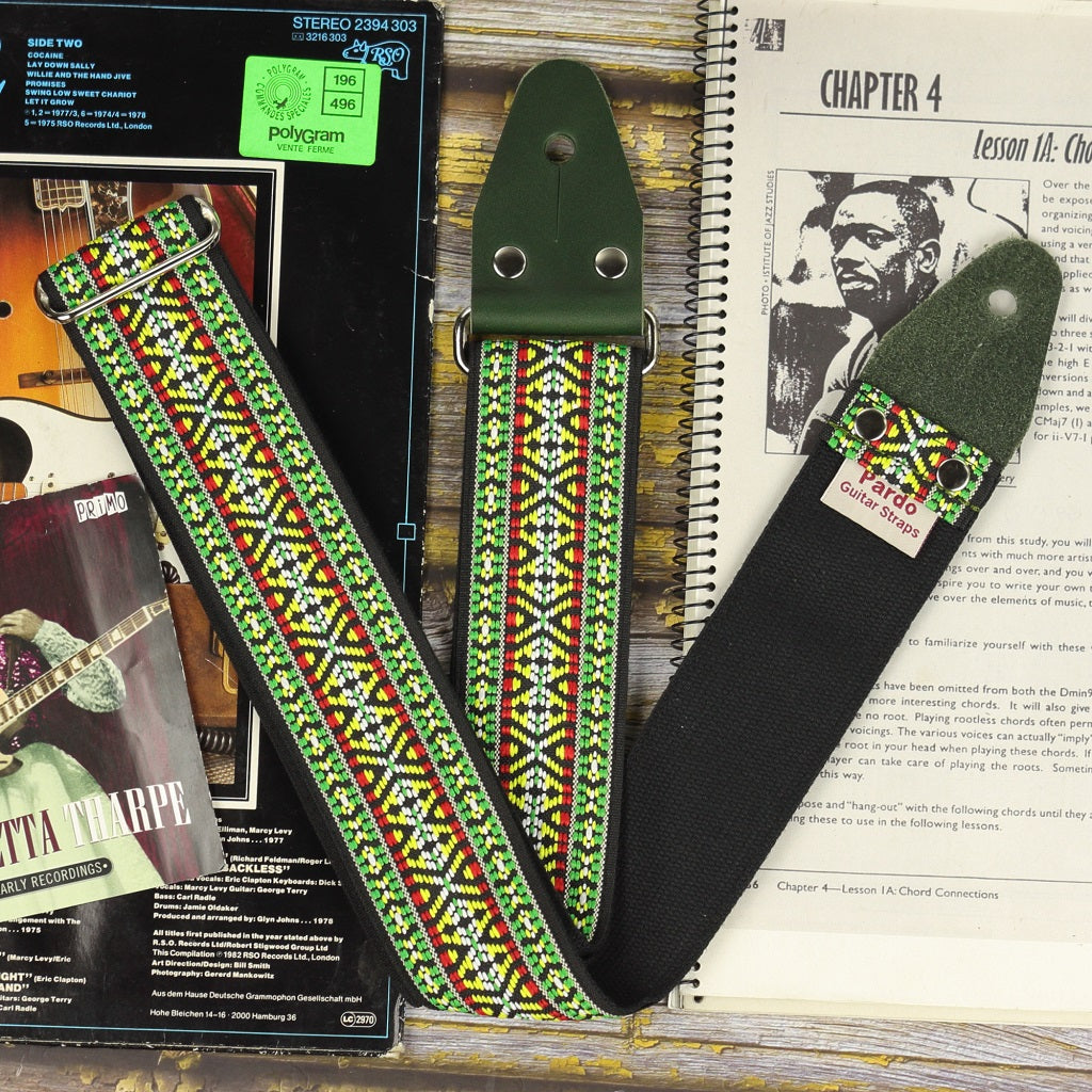 Green hootennany hippie guitar strap with backing black cotton ribbon