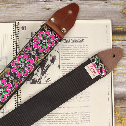 Close-up of the full strap laid out flat, showing the vibrant floral jacquard pattern.
