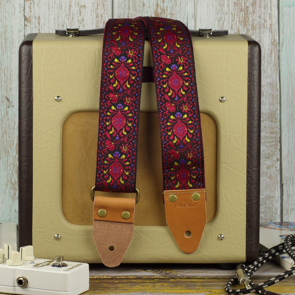 Pardo red bohemian guitar strap with a Fender Champion 600 Amplifier