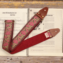 Full view of the Azalea pink floral guitar strap showing the retro pink and gold jacquard pattern with its Burgundy Red suede backing and handcrafted construction.