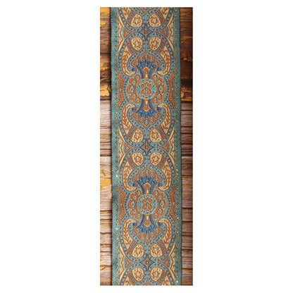 Close-up of the Blusie guitar strap design with symmetrical blue, copper and ivory ornamental details.