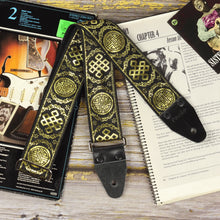 General view of the Medal black and gold guitar strap with shimmering gold jacquard pattern and black genuine leather ends.