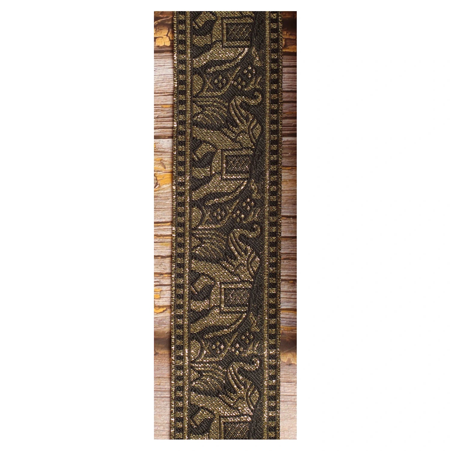 Black and gold elephant guitar strap featuring repeating elephant motifs woven in jacquard