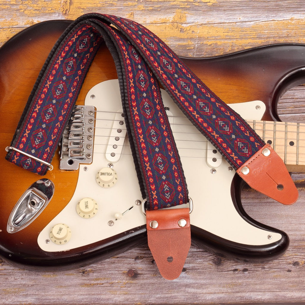 Cree strap attached to an electric guitar, showcasing fit and design