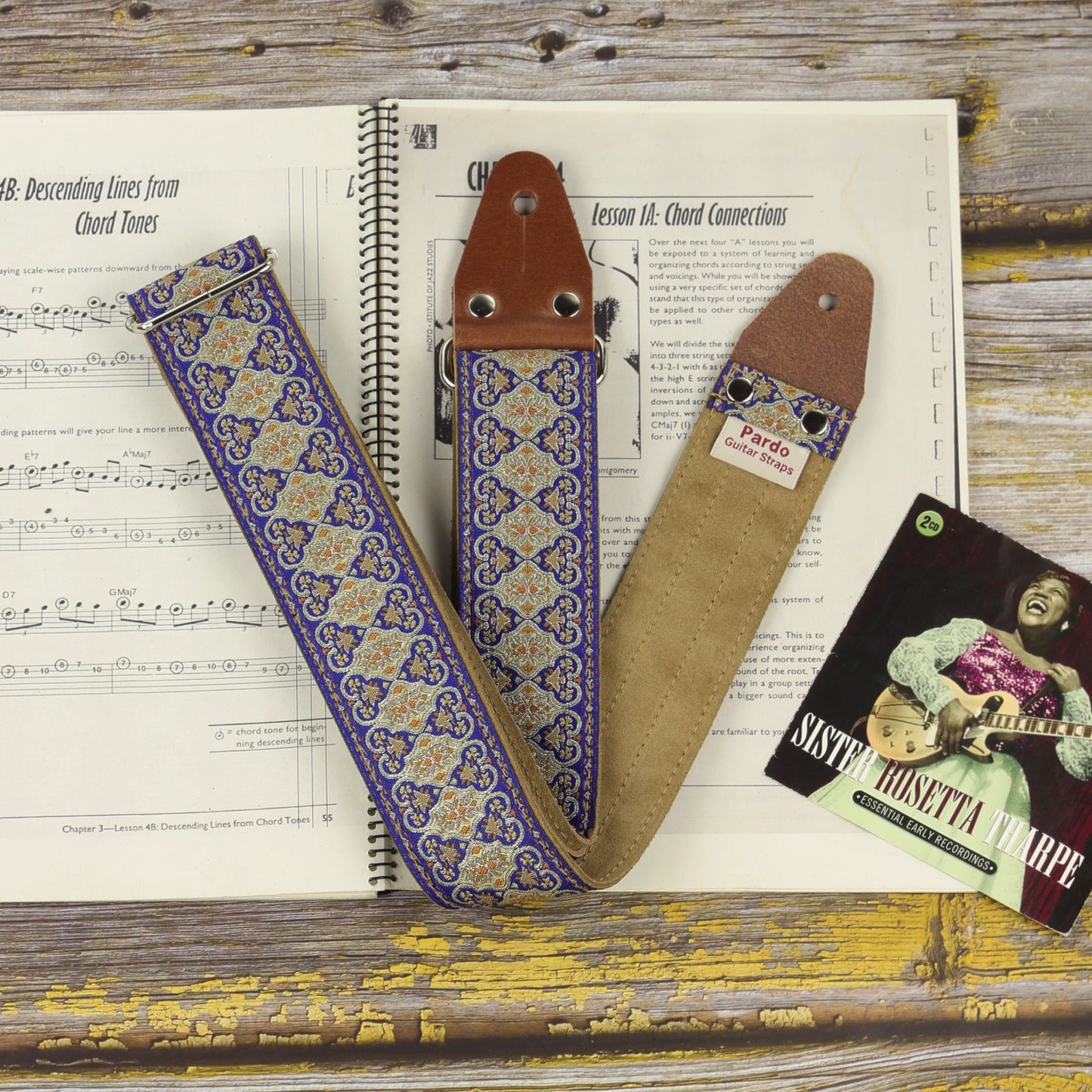 Front and rear views of the Blue Gothian guitar strap showing its detailed jacquard fabric and Clear Brown suede backing.