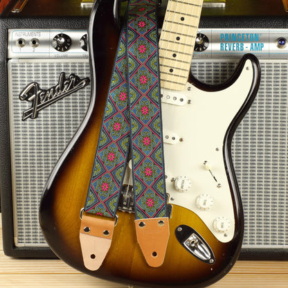 Blue Ocean guitar strap displayed with a Fender Stratocaster and a Fender Princeton Reverb Silverface amplifier.