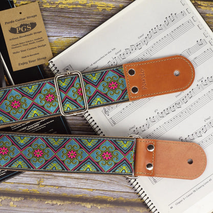Close-up of the Blue Ocean guitar strap showing its jacquard fabric and round-shaped leather ends.