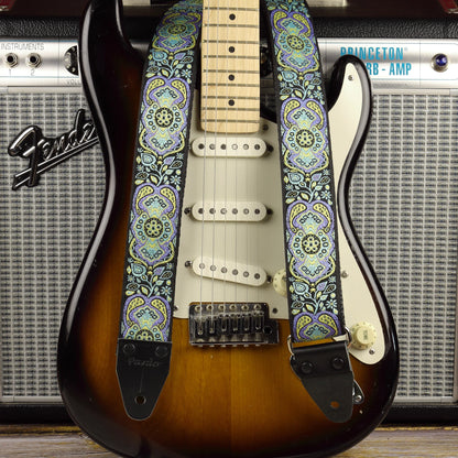 Blue Paisley guitar strap displayed with a sunburst Fender Stratocaster and a Fender Princeton Reverb amplifier.