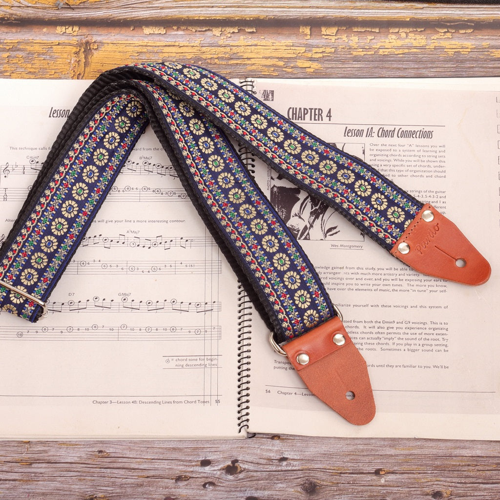 Blue Reverie floral jacquard guitar strap with blue background and cream flowers