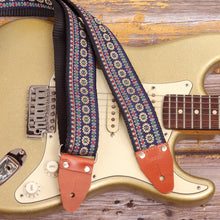 Close-up of Blue Reverie floral guitar strap on Fender Stratocaster Gold Sparkle electric guitar