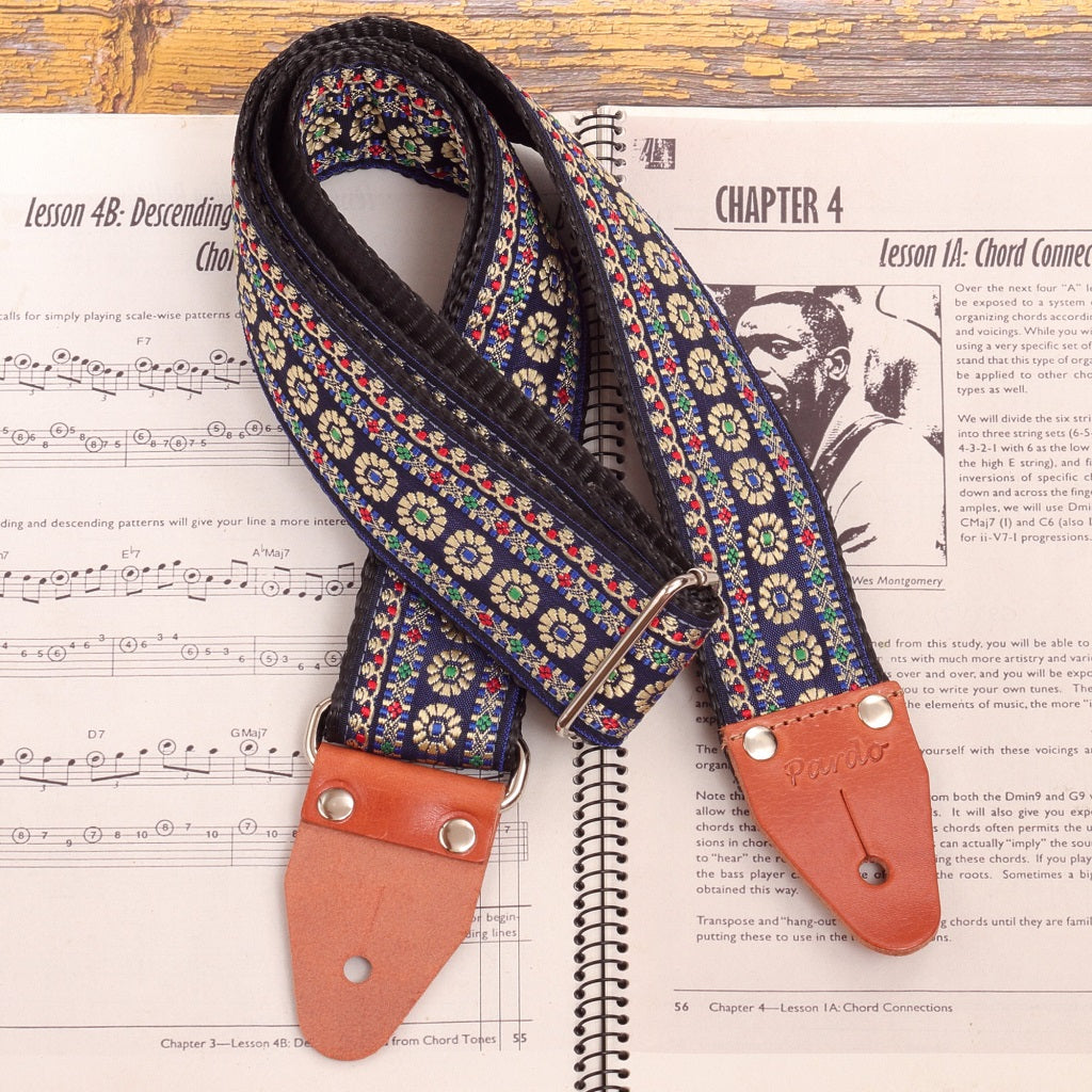 Close-up of genuine leather ends on Blue Reverie floral guitar strap