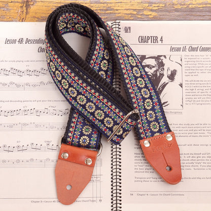 Close-up of genuine leather ends on Blue Reverie floral guitar strap