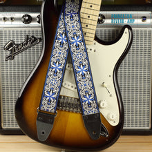 Featuring a Fender Stratocaster in sunburst with a Fender Princeton Reverb, this blue and white mosaic guitar strap showcases an intricate geometric pattern with continuous visual flow.