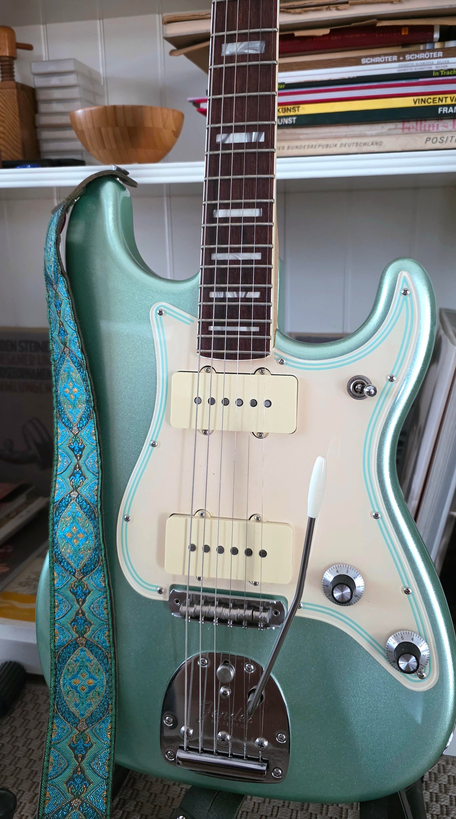 Fender Parallel Universe Strazzmaster in Metallic Surf Green, combining a Stratocaster body shape with Jazzmaster-inspired features.