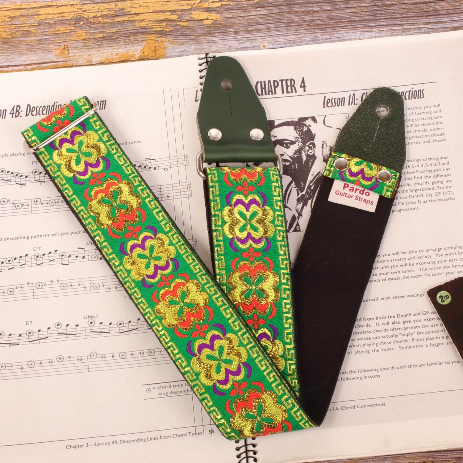 guitar strap with hippie pattern and psychedelic figures - green  color with red, lilac, yellow