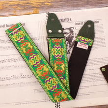 guitar strap with hippie pattern and psychedelic figures - green  color with red, lilac, yellow