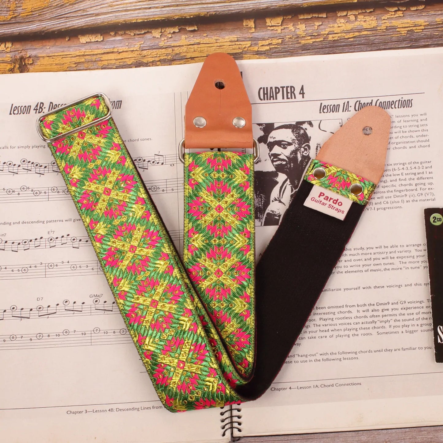 Guitar strap made with jacquard fabric with green, yellow and mora colors