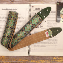 Green Royal vintage 60s guitar strap featuring a psychedelic kaleidoscope jacquard pattern and premium light brown suede backing.