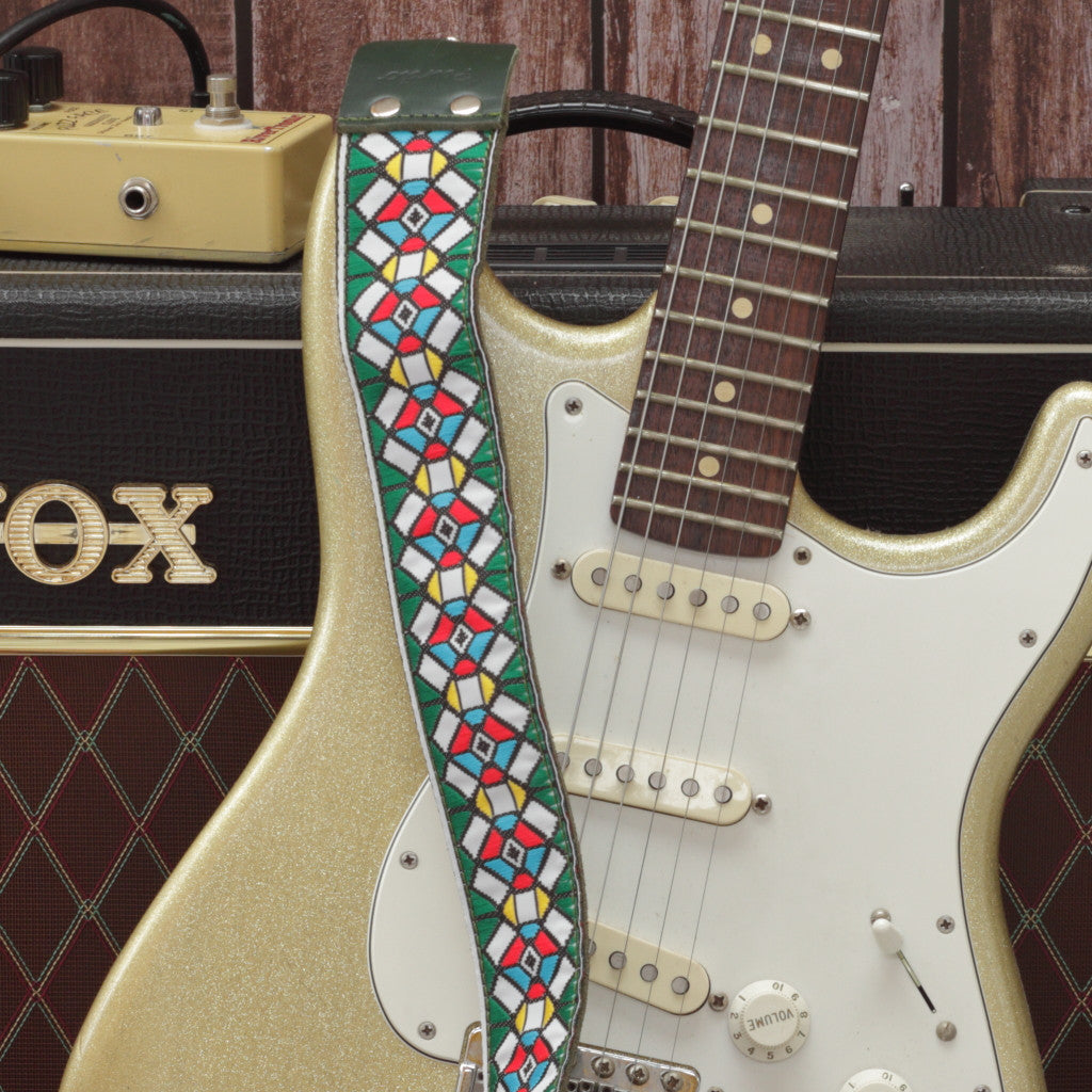 Green Stockholm guitar strap model paired with a fender stratocaster and a Vox ac10 amp