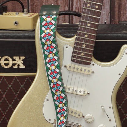 Green Stockholm guitar strap model paired with a fender stratocaster and a Vox ac10 amp