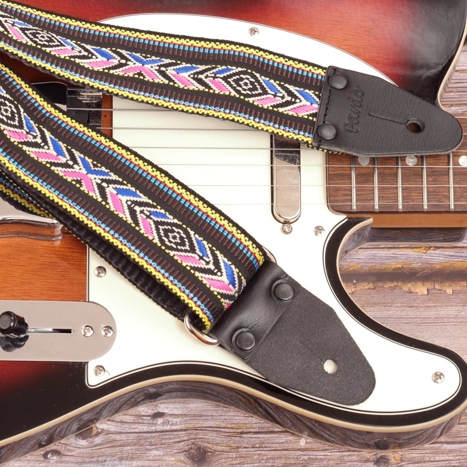 Zoomed-in image of the strap’s leather ends, showing reinforced stitching for secure guitar attachment.