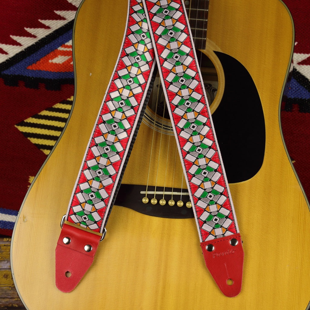 Red Stockholm guitar strap paired with an acoustic guitar - Pardo Guitar Straps