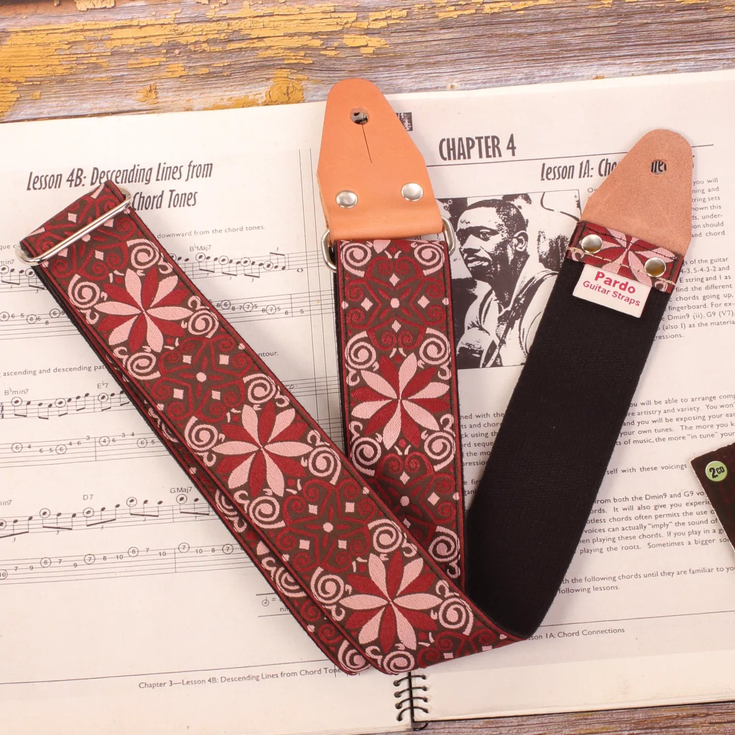 Guitar strap with vintage pattern, jacquard fabric in red wine colors, with stars and psychedelic shapes