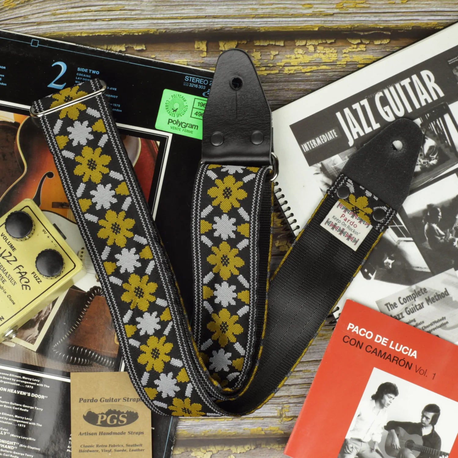 John Lennon The Beatles guitar strap replica, Rooftop model, featuring the floral pattern with black seatbelt customizable backing for durability.