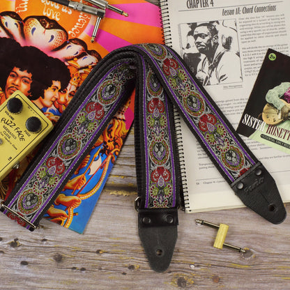 Front view of the King guitar strap showing its detailed jacquard pattern and black leather ends.