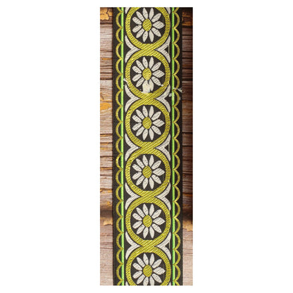 Meadow Echo woven guitar strap featuring delicate white botanical motifs against a green background.