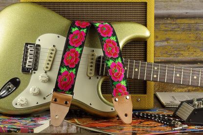Midnight Cameo guitar strap displayed with a gold sparkle Fender Stratocaster and a Fender Pro Junior amplifier.