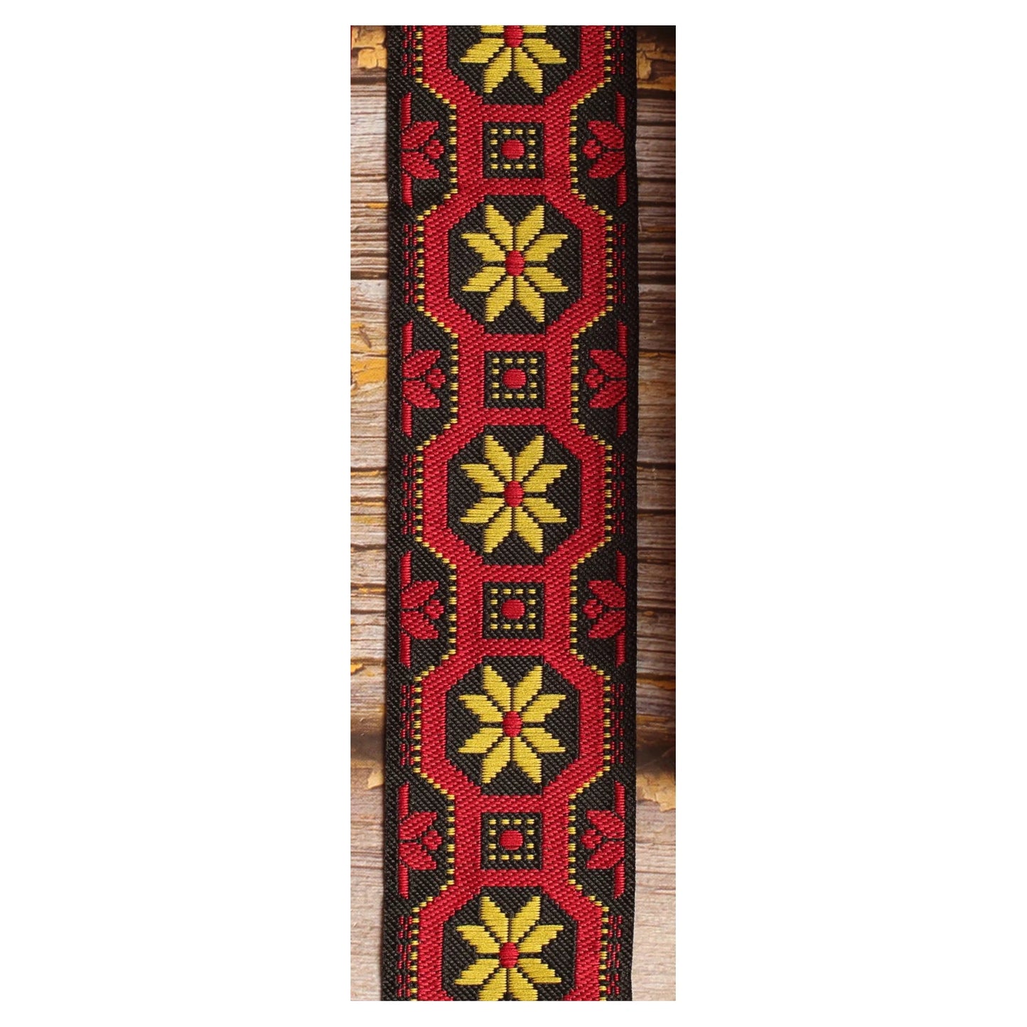 Mod Frame woven guitar strap featuring yellow decorative motifs framed in black with a distinctive 1960s-inspired look.