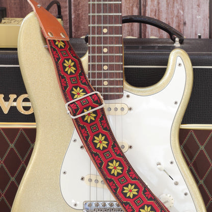 Mod Frame woven guitar strap displayed with a Fender Stratocaster, showing the full strap and its distinctive 1960s-inspired geometric pattern.