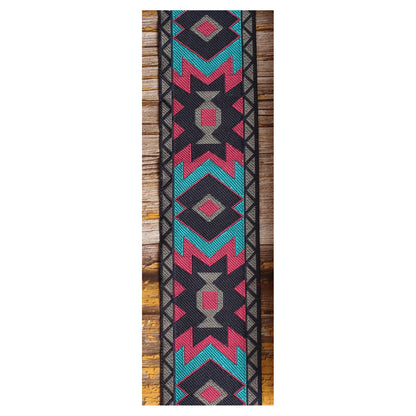 Close-up of the Canyon Pulse guitar strap design with turquoise, magenta and gray diamonds and stepped geometric lines.