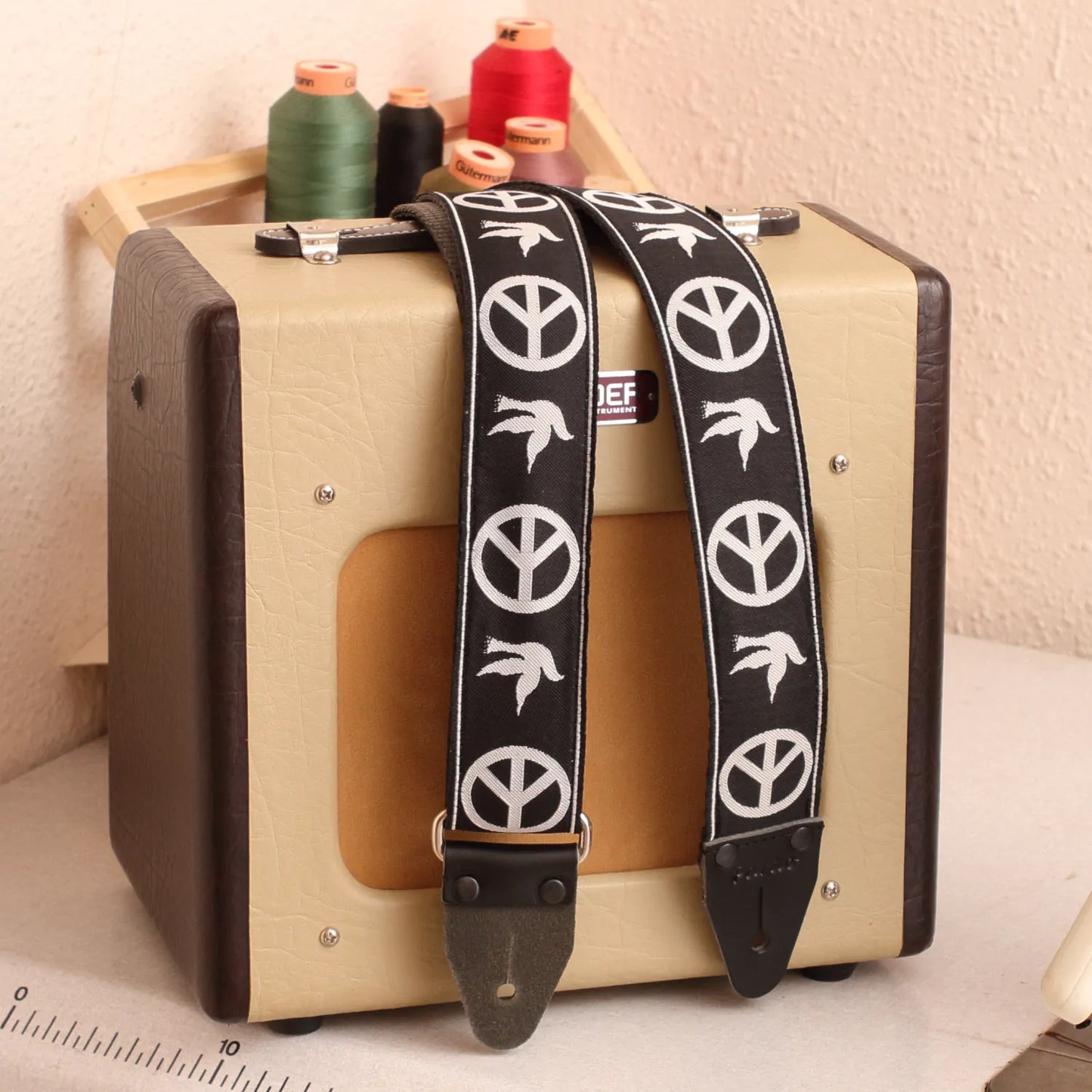 Neil Young Guitar Strap next to a Fender Champion 600 tube amplifier for scale