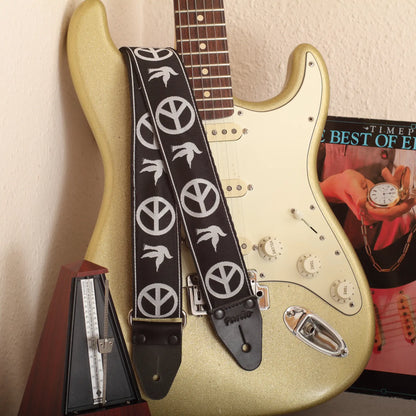 The Neil Young Guitar Strap attached to a classic Gold Sparkle Stratocaster electric guitar.