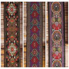 Three Nocturne Gallery guitar strap designs shown together: Red Fly, Purple Frame and King.
