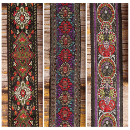 Three Nocturne Gallery guitar strap designs shown together: Red Fly, Purple Frame and King.