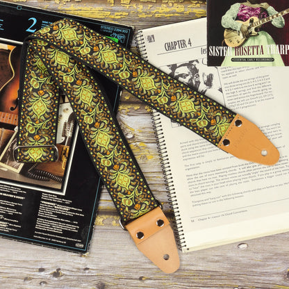 Full view of the Ochre Pheasant guitar strap with its jacquard pattern and light brown leather ends