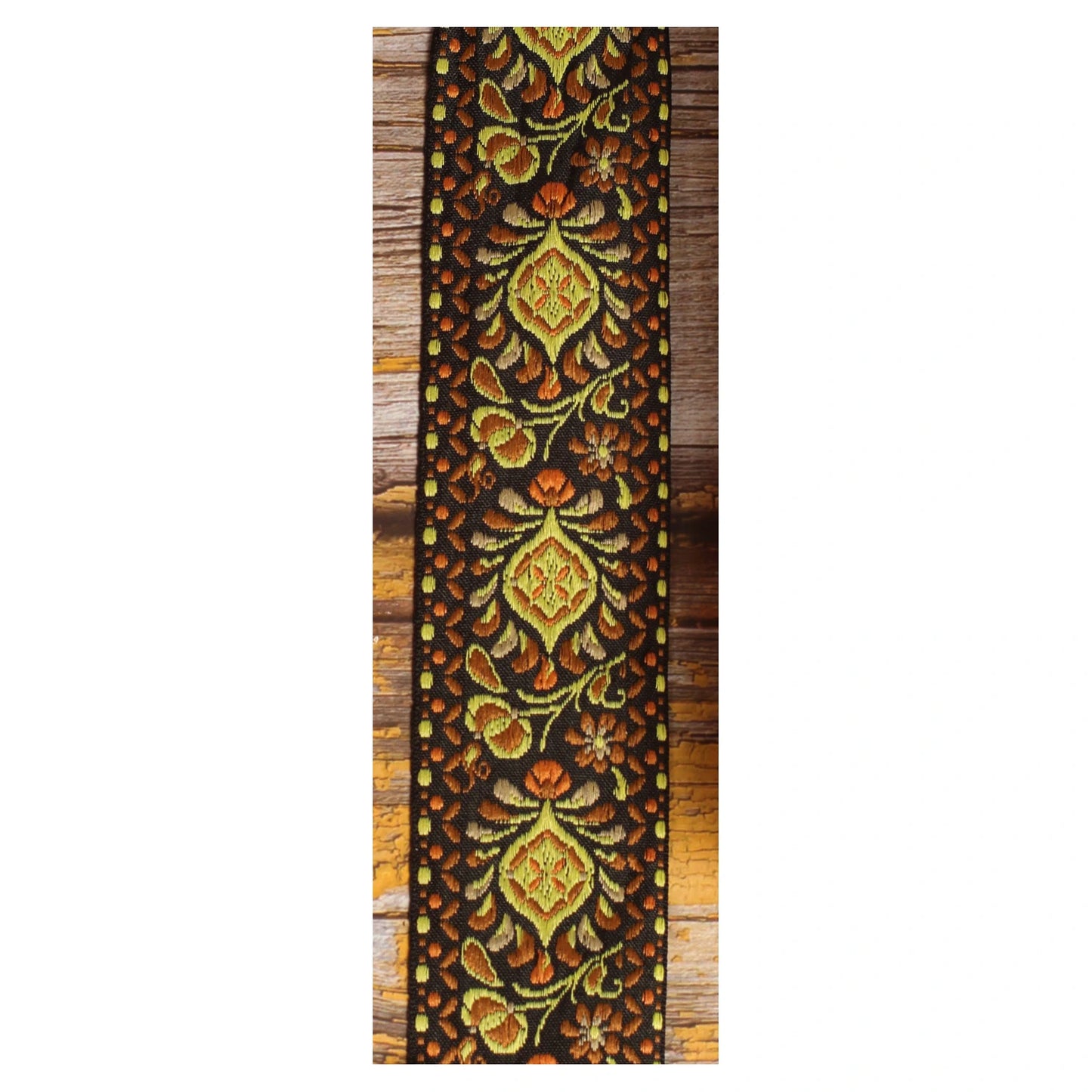 Ochre Pheasant woven strap pattern with olive, orange and golden motifs on a black background