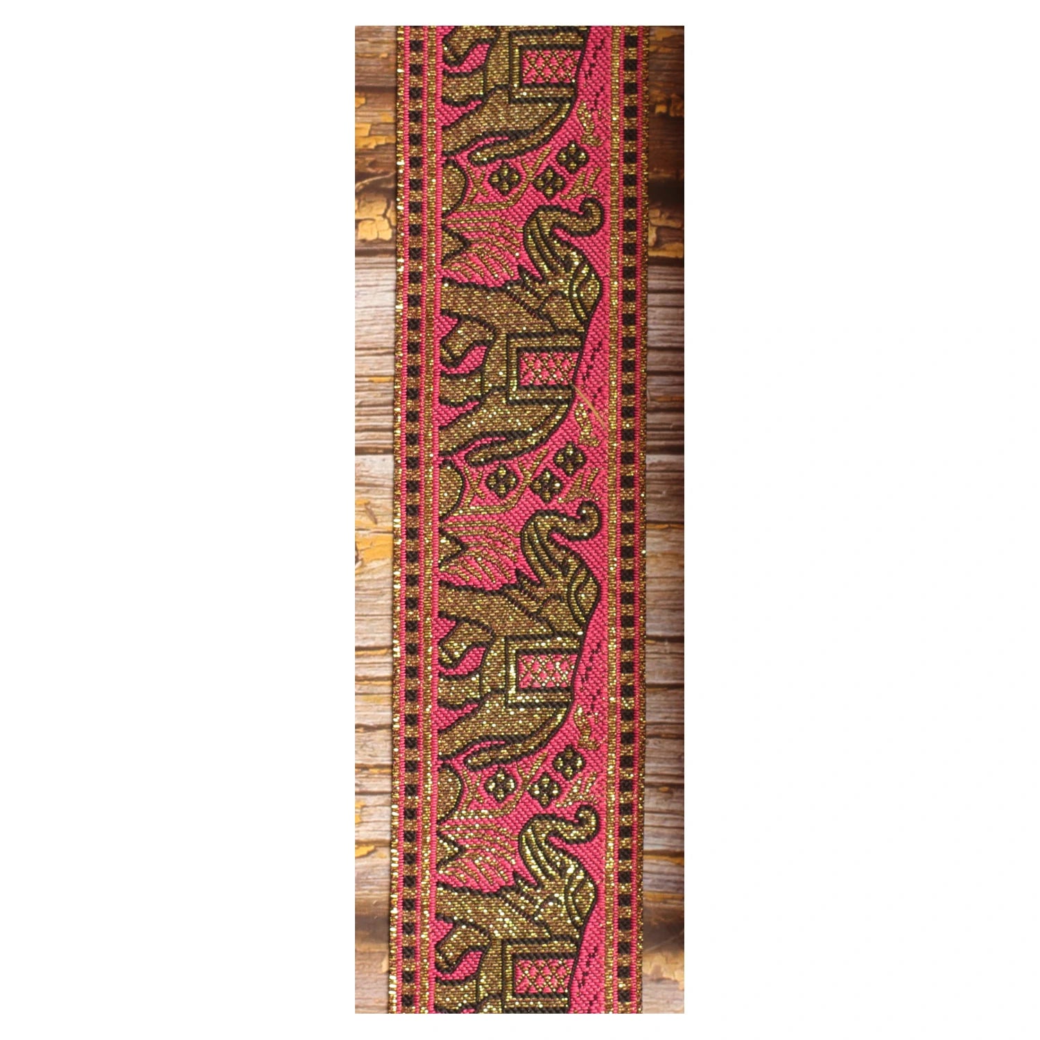 Pink and gold elephant guitar strap with decorative woven jacquard pattern and metallic details