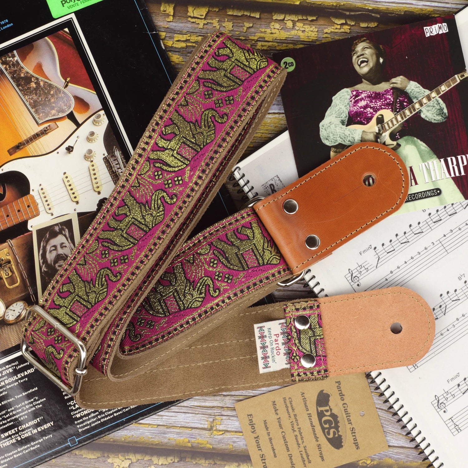 Pink and gold elephant jacquard guitar strap with Clear Brown suede backing and round-shaped leather ends