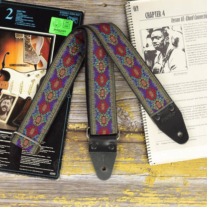 Front view of the Purple Frame guitar strap showing its detailed jacquard fabric and black leather ends.