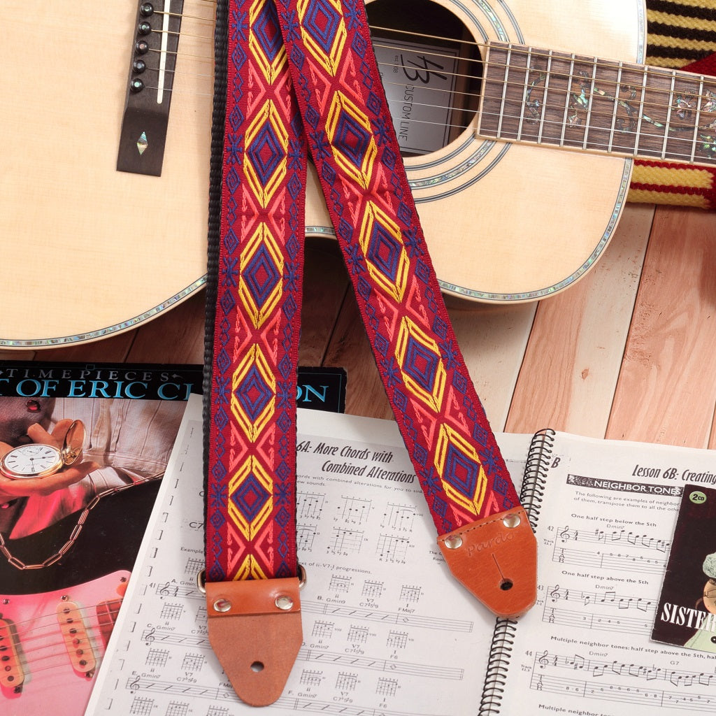 Acoustic guitar strap with red and yellow tribal design