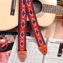 Acoustic guitar strap with red and yellow tribal design