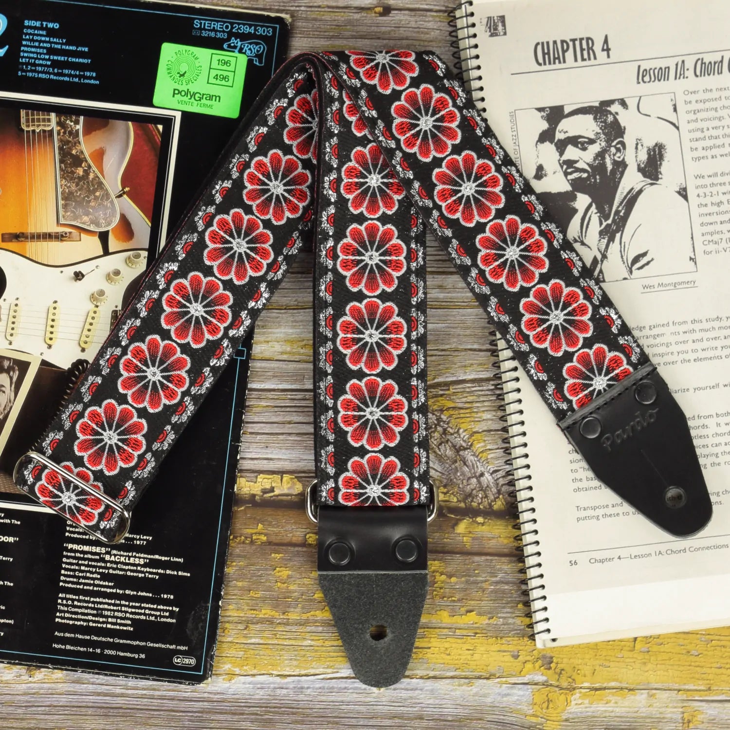 Pardo Red Flowers Jacquard guitar strap, handmade in Spain. Fully adjustable strap with red floral pattern on black background