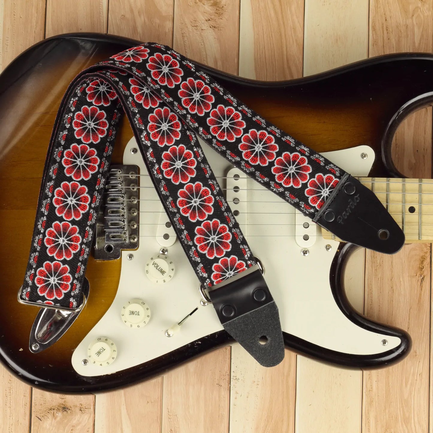 Stylish Red Flowers strap combined with a vintage-style Stratocaster electric guitar