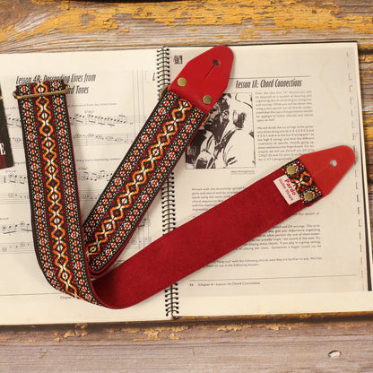 Rear view of the Red Marley red and orange jacquard guitar strap showing the burgundy suede backing, handcrafted construction and vintage reggae-inspired woven design.
